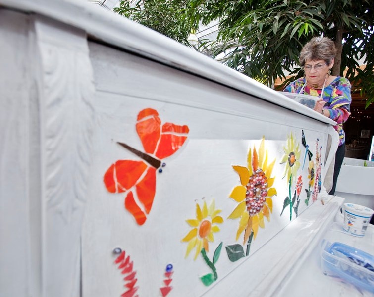 PIANO LADY – Artist Helen Rogers works on her original design as St. Albert Cultivates the Arts Society gears up for the StArts Festival with Keys for the City – an