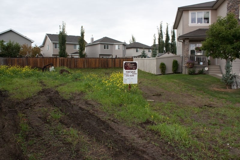 UNSIGHTLY LOTS – Erin Ridge Dr. has some lots which have remained undeveloped for years and the builder