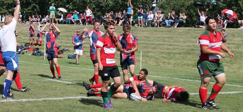 SCORING PLAY &#8211; Fans and players from St. Albert and the Druids-Lep/Tigers react to Chad Monai-Brophy&#8217;s try in the first quarter of Saturday&#8217;s U17 Edmonton