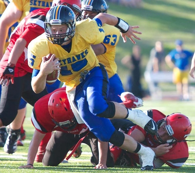 BREAKING AWAY &#8211; St. Albert High Skyhawks&#8217; quarterback Keith Zyla rushed for more than 100 yards and scored three touchdowns in Wednesday&#8217;s 29-22 win over