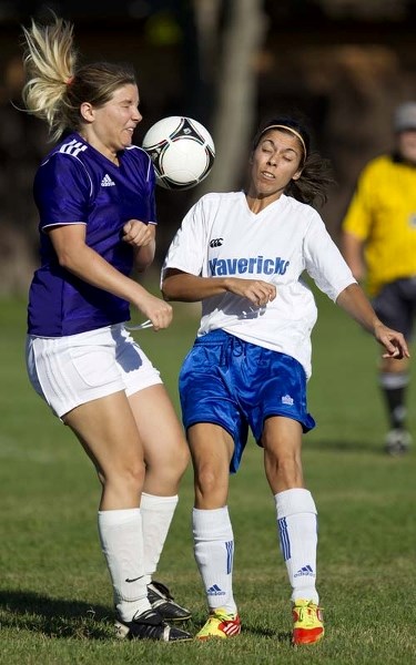 PLAYOFF CHALLENGE &#8211; Angela Veenstra of the Lady Titans and Chelsey Marques of Mavericks 09 play the ball in Sunday&#8217;s division one semifinal in the St. Albert