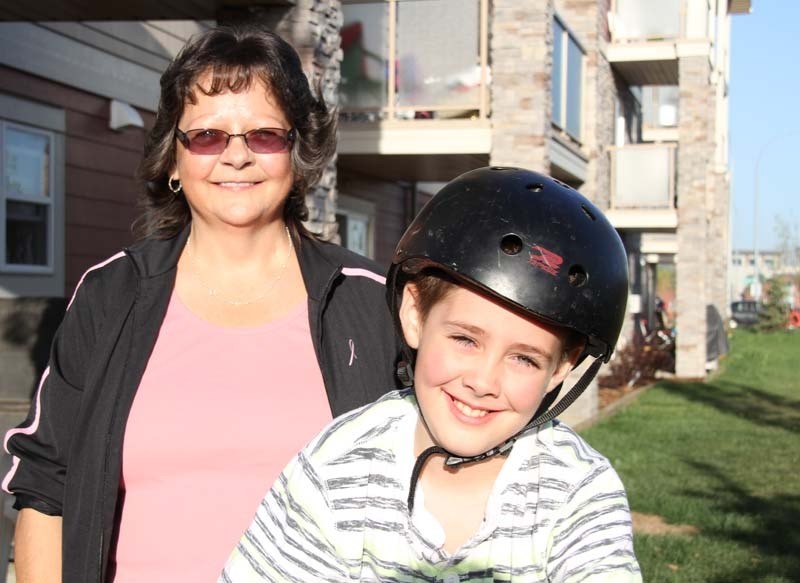 HAPPY RESIDENTS – Susan Grant and her son Cory are thankful to be living at the new of Big Lake Pointe affordable housing complex.