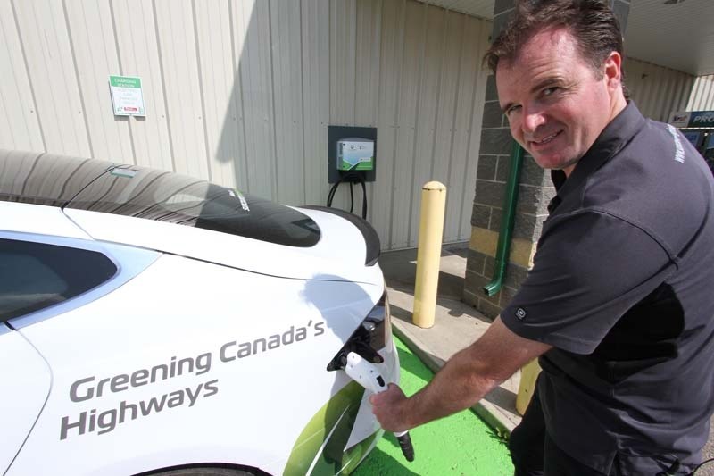 FILL &#8216;ER UP – Sun Country Highway CEO Kent Rathwell plugs in his electric car at Peavey Mart Red Deer.