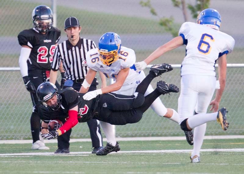 TRIPPED UP &#8211; Tyler Feltis of the Bellerose Bulldogs takes a spill in the first quarter of Thursday&#8217;s game against the Bev Facey Falcons at Riel Recreation Park.