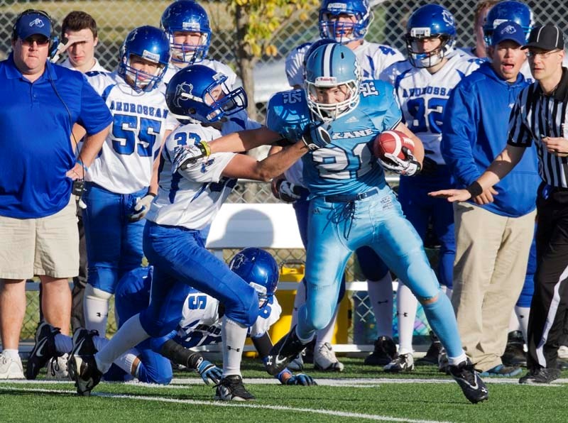 POWER PLAY &#8211; A determined Theo Block of the Paul Kane Blues fights for extra yards against the Ardrossan Bisons in Thursday&#8217;s 43-20 victory at Riel Recreation