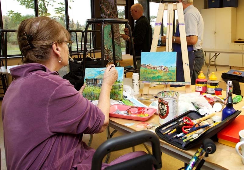 HARD AT WORK &#8211; Carol Brown prepares a piece of art for the upcoming painters&#8217; guild show.