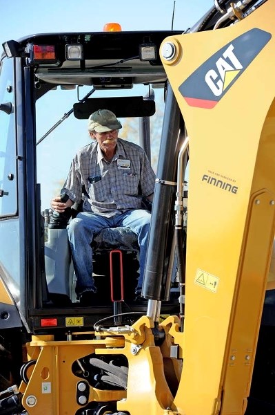 GAME FACE – City of St. Albert utility worker Art Adcock takes part in the backhoe event at the Equipment Roadeo in Red Deer in September.