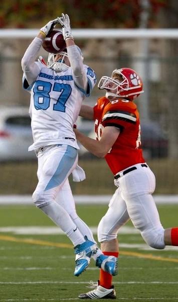 PICK PLAY &#8211; Tyler Turner of the Paul Kane Blues picks off a pass in the fourth quarter in Thursday&#8217;s 63-21 rout of the McNally Tigers at Clarke Park. The Blues