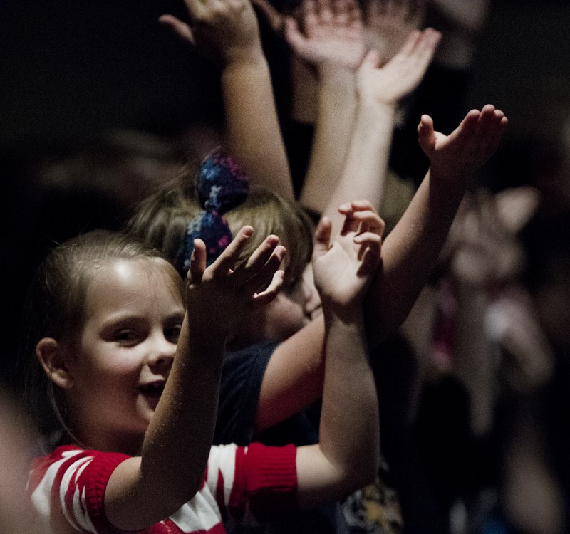 ARMS UP &#8211; A school song during the memorial for Thomas Wedman had many participants raising their arms.