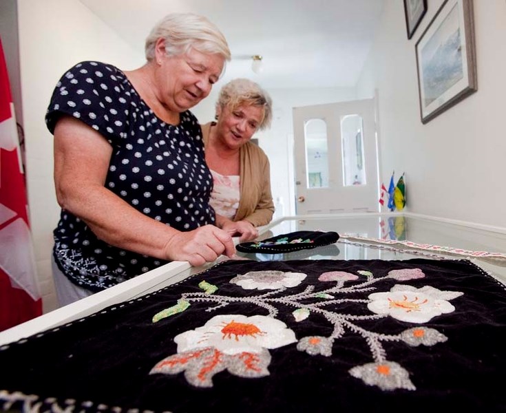 FAMILY CONNECTION – St. Albert Gazette reporter Susan Jones (left) and Betty Fraser of the Michif Institute share a family connection through their aunts. Here the two look