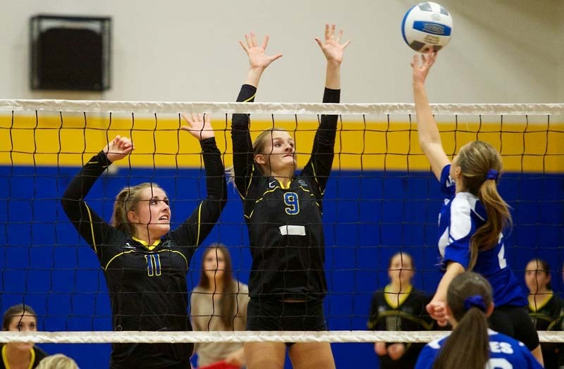 REACH FOR THE TOP &#8211; Jessica Baird (11) and Emily Groenenboom of the St. Albert Skyhawks defend the net against Jae-Lyn Visscher of the Paul Kane Blues in