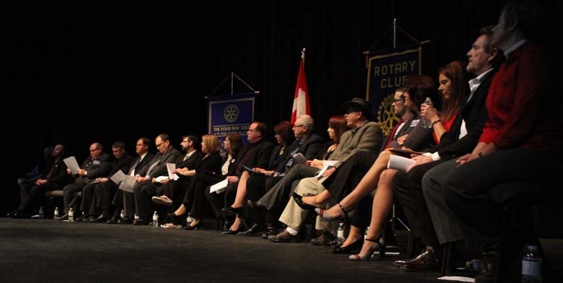 LARGE GROUP – All 21 Morinville town council candidates crowd the stage at the Community Cultural Centre before splitting off into smaller groups for the event&#8217;s
