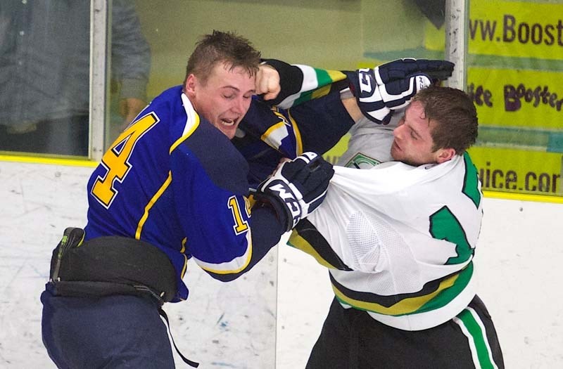 JUNIOR B BOUT &#8211; Stefan Meunier of the St. Albert Merchants and David Kozoriz of the Sherwood Park Knights duke it out in the second period in Sunday&#8217;s junior B