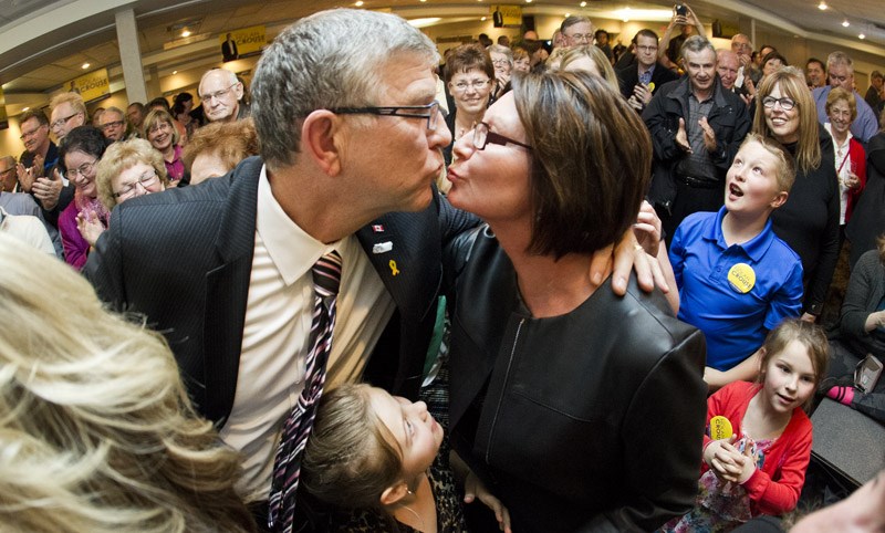 SEALED WITH A KISS – Nolan Crouse gets a kiss from his wife Gwen after learning that he&#8217;s earned a third term as mayor of St. Albert.