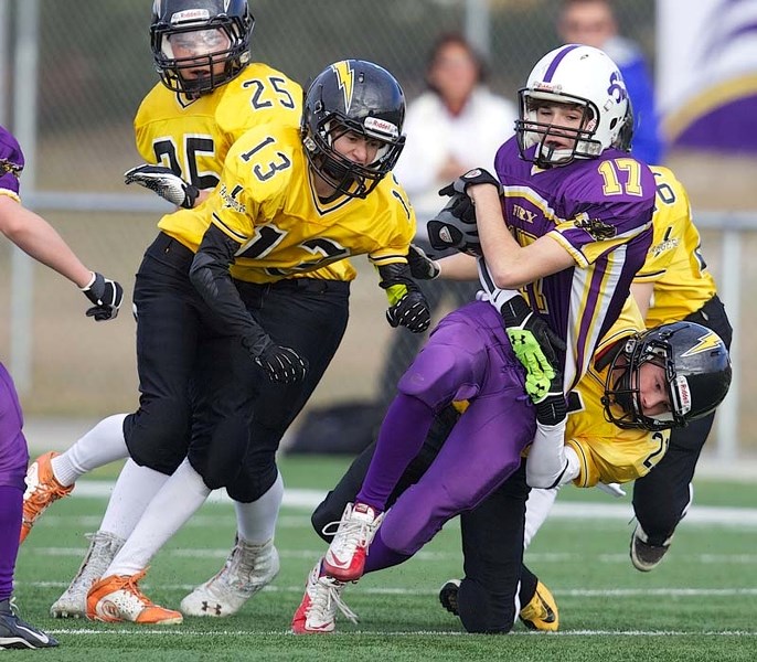 TRIPPED UP &#8211; Jesse Stuht of the St. Albert Fury is stopped by the Edmonton Chargers in Sunday&#8217;s bantam Tier 1/2 game in the Capital District Minor Football