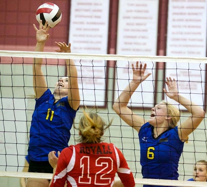 PLAY AT THE NET &#8211; Jessica Baird (11) and Morgan Rigelhof of the St. Albert Skyhawks react to the ball in Saturday&#8217;s semifinal against the Beaverlodge Royals at