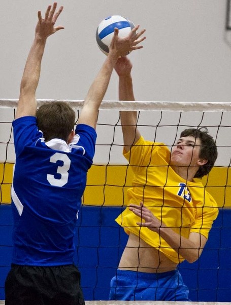 BALL STRIKER &#8211; A.J. Armstrong of the St. Albert Skyhawks spikes the ball against the Paul Kane Blues in Tuesday&#8217;s best-of-five pool B match in metro Edmonton