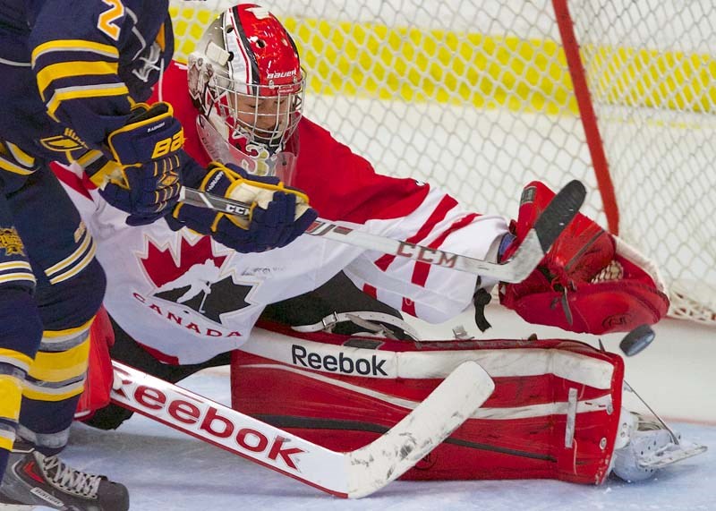 NET GUARDIAN &#8211; Team Canada goalie Charline Labonté reaches out to make a save as St. Albert Raiders&#8217; forward Ethan Lazaro gets a goalmouth chance Monday at