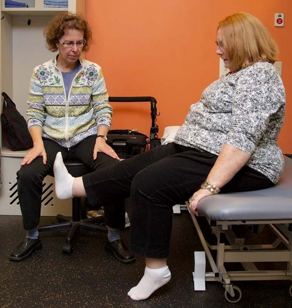 EASY DOES IT – Patient Barbara Carson works through some knee exercises as part of the rehabilitation program she underwent as part of a study. She&#8217;s coached through
