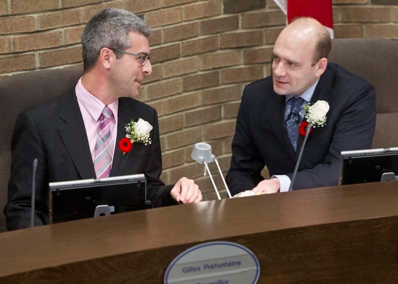 FIRST DAY &#8211; Coun. Gilles Prefontaine (left) and Coun. Cam MacKay (right) chat during the swearing-in ceremony in council chambers Monday night.