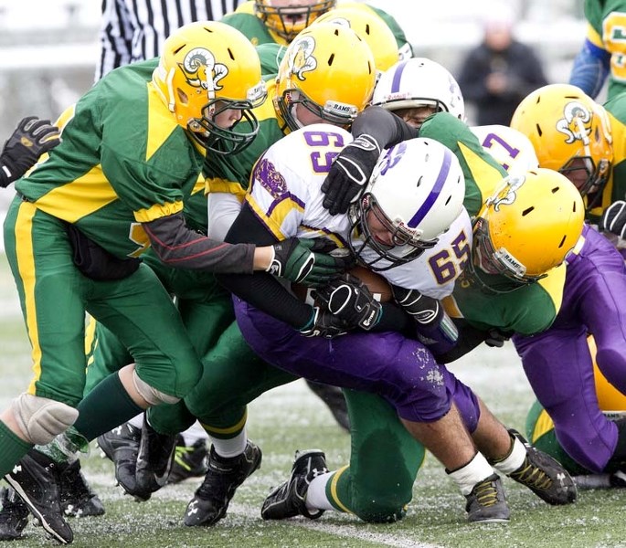 RAM TOUGH &#8211; Jacob Pasqual of the St. Albert Fury is gang tackled by the Sherwood Park Rams in the bantam Tier 1 final Sunday in the Capital District Minor Football