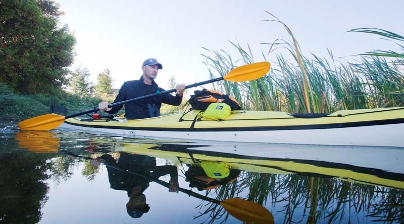 HANDS-ON RESEARCH &#8211; Conservation biologist Matthew Wheatley heads off to Big Lake in his kayak in September to do some location scouting for a bird study he&#8217;s