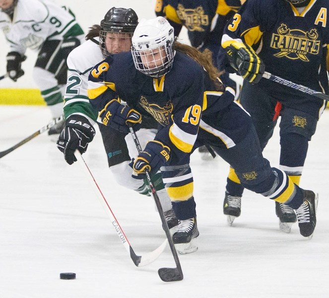 SAINTS SLASHED &#8211; Kennedy Newton of the St. Albert Slash attacks the puck against the Spruce Grove Saints last weekend in Alberta Major Midget Female Hockey League.