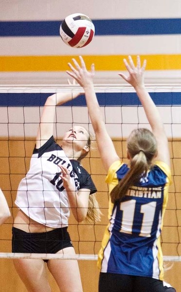 SWINGING AWAY &#8211; Katie Bornia of the Bellerose Bulldogs attacks the ball against Lori Hofstede of the Edmonton Christian Lions in the metro Edmonton division two final