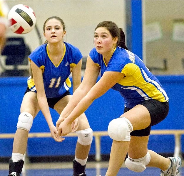 DIG IT &#8211; Alexis Anderson (11) and Elaine Cloutier of the St. Albert Skyhawks play the ball in metro Edmonton junior playoff action. The Skyhawks (12-1) won their first