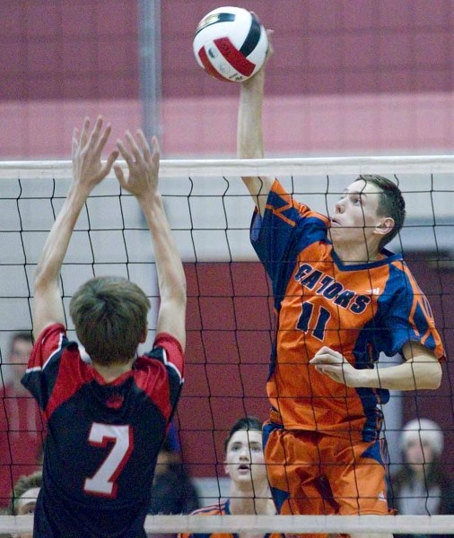 HIT TO WIN &#8211; Alex Holmes of the Lorne Akins Gators spikes the ball against Kole Toma of the Sir George Simpson Voyageurs in the SAPEC Tier 1 final Tuesday at Bellerose