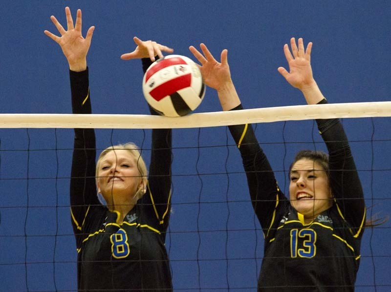 TEAMWORK &#8211; Taylor Thompson (left) and Nicole Brown of the St. Albert Skyhawks join forces for a block at the 3A provincial volleyball championships Thursday at the