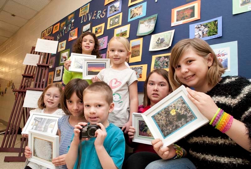 TOP SHOTS – Grade 2 student Davis Mack (with camera) poses with the runners up for Keenooshayo&#8217;s first annual Nature Lovers photo contest held late November. The contest