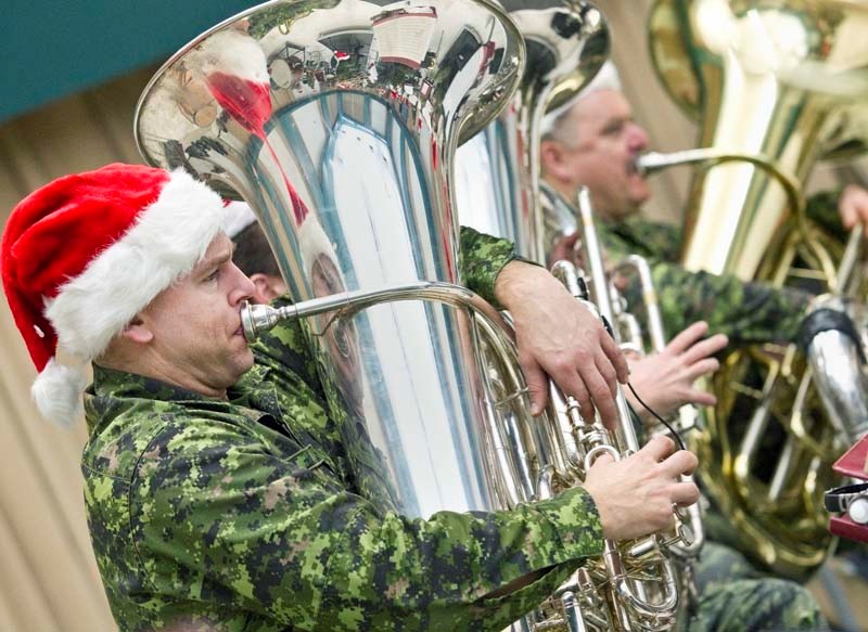 CHRISTMAS WISH – Sgt. Dan Pain works the tuba Tuesday morning as the Royal Canadian Artillery Band rehearses for its annual Christmas Wish concert on Friday