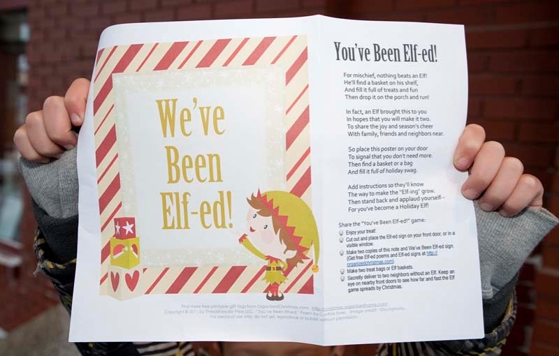 ELF NOTE – St. Albert resident Lucas Murphy holds up the note his family recently received along with a mysterious bag of gifts. A wave of anonymous gift giving swept through 