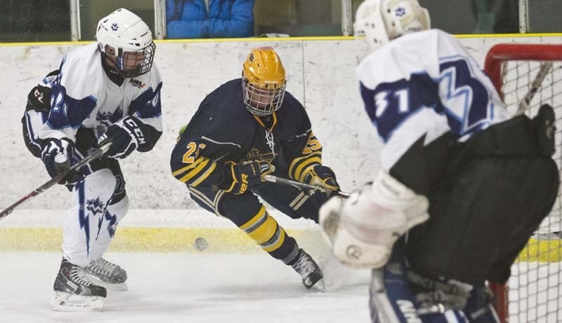 ZONING IN &#8211; Ethan Lazaro of the St. Albert Raiders attacks the puck in the offensive zone in Wednesday&#8217;s midget AAA game against the Maple Leafs at Akinsdale
