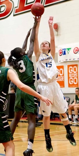 SHOT MAKER &#8211; Marinya Marcichiw of the St. Albert Skyhawks releases the ball against Madelene Kajusa of the St. Mary&#8217;s Saints of Calgary at the 32nd annual Reb