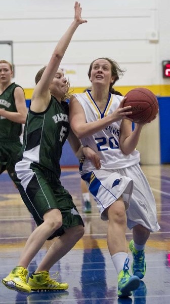 FEELING THE HEAT &#8211; Sam Dargis of the St. Albert Skyhawks is pressured in the paint by Madison Whiting of the Spruce Grove Panthers in Monday&#8217;s metro Edmonton