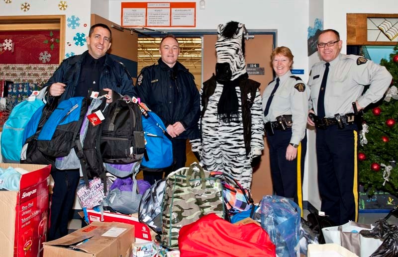 SUPPLIES FOR THE SMALLEST VICTIMS: FROM LEFT: EPS officers Sgt. Gary Willits and Cst. Barry Fairhurst