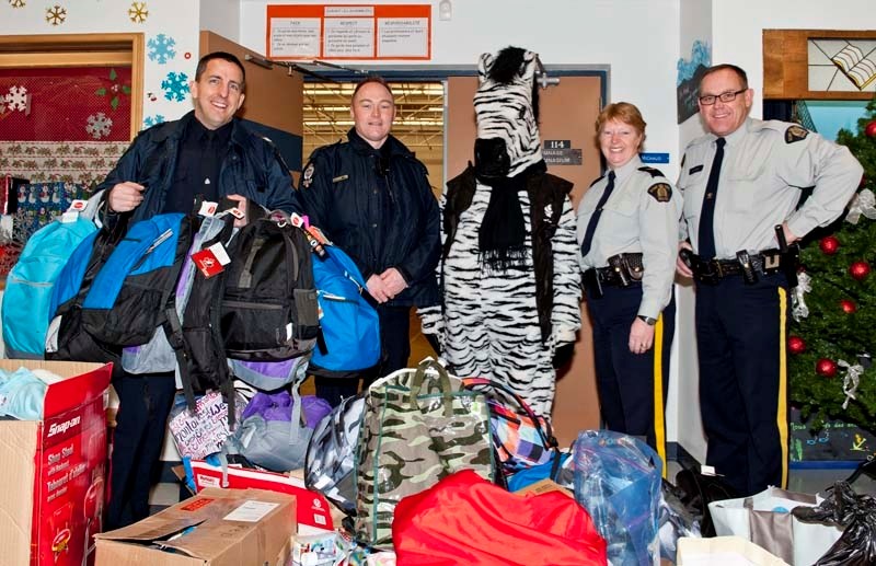 SUPPLIES FOR THE SMALLEST VICTIMS: FROM LEFT: EPS officers Sgt. Gary Willits and Cst. Barry Fairhurst