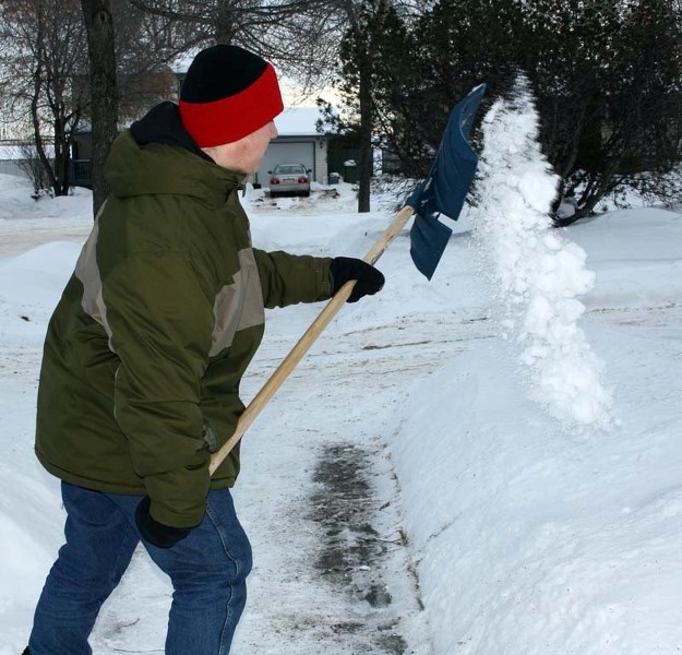 LAW ABIDING – The city requires homeowners to remove snow/ice from in front and alongside their property within 48 hours of a snowfall.