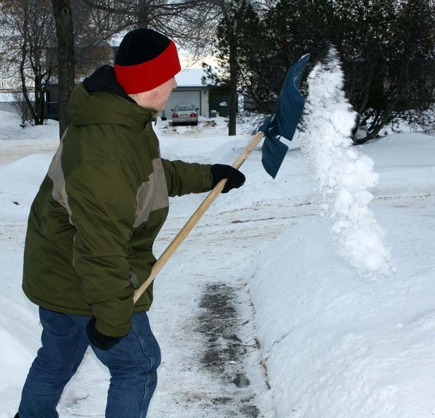 LAW ABIDING – The city requires homeowners to remove snow/ice from in front and alongside their property within 48 hours of a snowfall.
