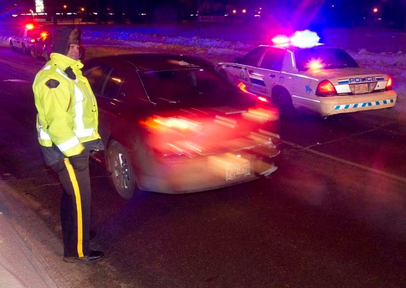 ROADSIDE ATTRACTION – Const. Bruce Mcgilvray of the RCMP participates in a Checkstop along Campbell Road on Saturday