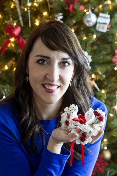 SENTIMENTAL ORNAMENTALS – Nicole Mackoway holds some Christmas ornaments she made with her mother when she was 16. Her mom died three years later so Mackoway now hangs them
