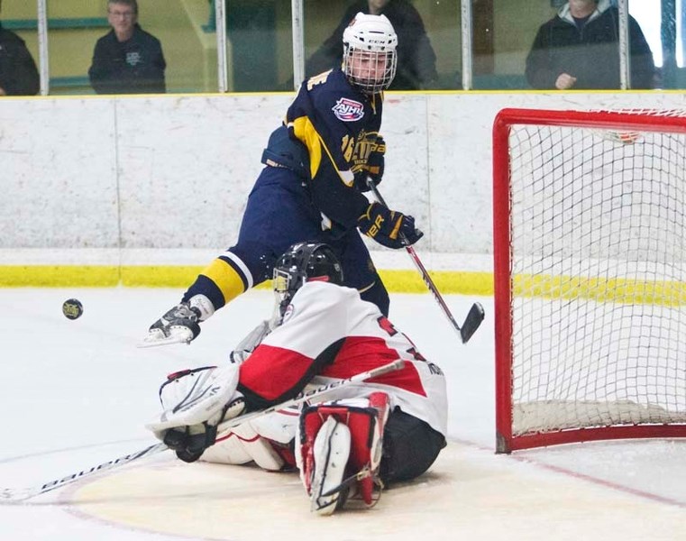 NO GOAL &#8211; Jaedon Leslie of the St. Albert Flyers is denied a goal by Ryley Packet of the Camrose Vikings in Sunday&#8217;s midget 15 game at Akinsdale Arena. Leslie did 