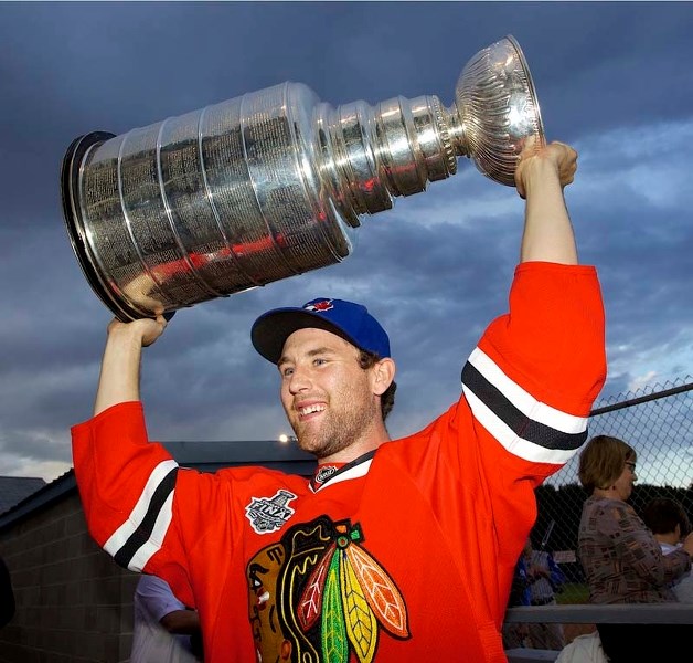 HOMETOWN HERO &#8211; Ryan Stanton hoists the Stanley Cup as a member of the Chicago Blackhawks at Meadowview Diamonds on Aug. 28. Hundreds of fans showed up to see Lord