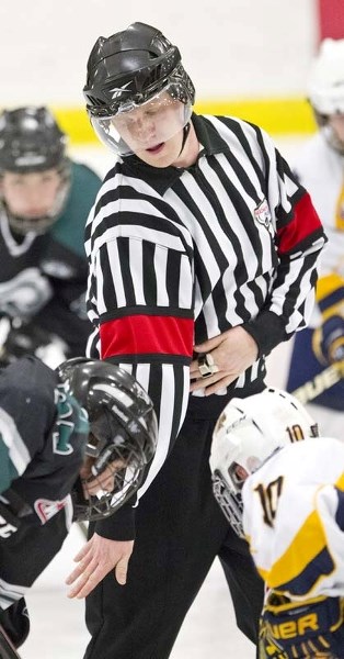 STAR IN STRIPES &#8211; Leasure Forbes performs a faceoff at Thursday&#8217;s bantam AAA game between the St. Albert Gregg Distributors Sabres and Spruce Grove PAC Saints at