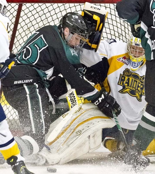 LAST LINE OF DEFENCE &#8211; Nate Reinhart of the St. Albert Gregg Distributors Sabres keeps the puck out of the net against Ian Mitchell of the Spruce Grove PAC Saints in