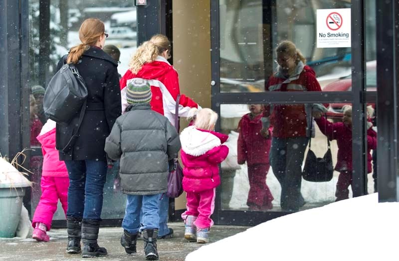 BUSY CLINIC – People enter the St. Albert Public Health Centre to receive their flu vaccinations on Tuesday. The wait time was about three hours during the afternoon.