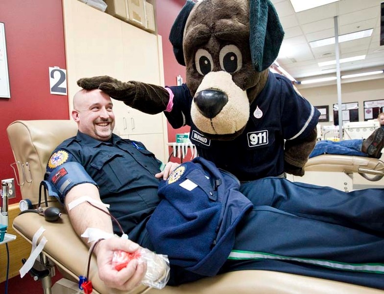 FROM THE HEART – EMS worker Daniel Sabourin gives blood Tuesday during the kickoff to the Sirens for Life campaign.