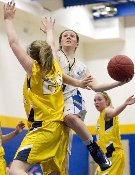 POWER PLAY &#8211; Kayla Ivicak of the St. Albert Skyhawks goes to the hoop against Hailie McCormack of the Bev Facey Falcons in Wednesday&#8217;s metro Edmonton division one 